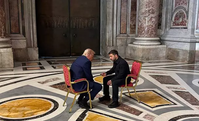 In this photo provided by the Ukrainian Presidential Press Office, Ukraine's President Volodymyr Zelenskyy, right, and President Donald Trump, talk as they attend the funeral of Pope Francis in Vatican, Saturday, April 26, 2025.(Ukrainian Presidential Press Office via AP)