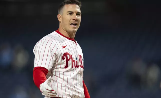Philadelphia Phillies' J.T. Realmuto reacts to being called out on strikes to end the baseball game against the San Francisco Giants, Wednesday, April 16, 2025, in Philadelphia. (AP Photo/Chris Szagola)