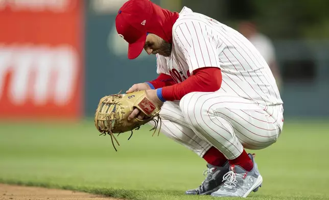 Philadelphia Phillies first baseman Bryce Harper looks down during the seventh inning of a baseball game against the San Francisco Giants, Wednesday, April 16, 2025, in Philadelphia. (AP Photo/Chris Szagola)