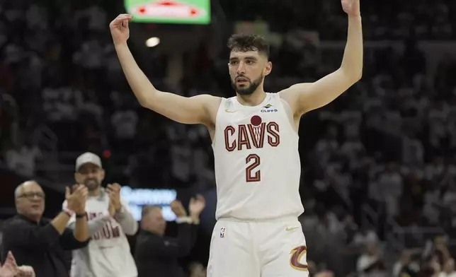 Cleveland Cavaliers guard Ty Jerome (2) gestures to fans in the second half in Game 1 of an NBA first-round playoff series against the Miami Heat, Sunday, April 20, 2025, in Cleveland. (AP Photo/Sue Ogrocki)