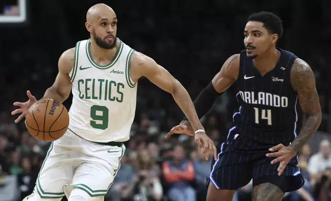 Boston Celtics' Derrick White (9) drives past Orlando Magic's Gary Harris (14) during the first half in game 1 of a first-round NBA playoff basketball series Sunday, April 20, 2025, in Boston. (AP Photo/Michael Dwyer)