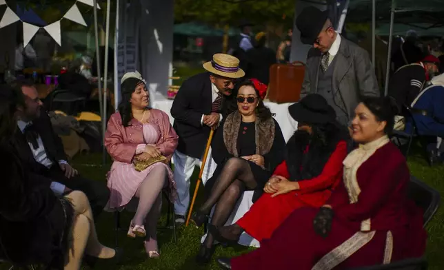Participants gather for an Old Fashioned Fest at a park in Santiago, Chile, Saturday, April 5, 2025. (AP Photo/Esteban Felix)