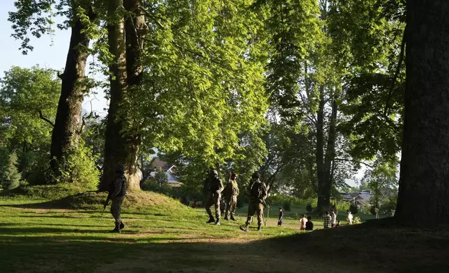 Indian paramilitary soldiers guard inside a Mughal garden on the outskirts of Srinagar, Indian controlled Kashmir, Sunday, April. 27, 2025.(AP Photo/Mukhtar Khan)