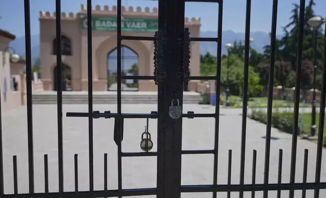 A locked garden gate is seen in Srinagar after it was closed by authorities as a precautionary safety measure following last week's deadly attack on tourists near the resort town of Pahalgam, Indian controlled Kashmir, Tuesday, April 29, 2025. (AP Photo/Mukhtar Khan)
