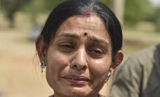 Indian national Komal breaks down while seeing off her brother and his wife, both Pakistani citizens, at the Attari-Wagah border between India and Pakistan, near Amritsar, India, Tuesday, April 29, 2025. (AP Photo/Prabhjot Gill)