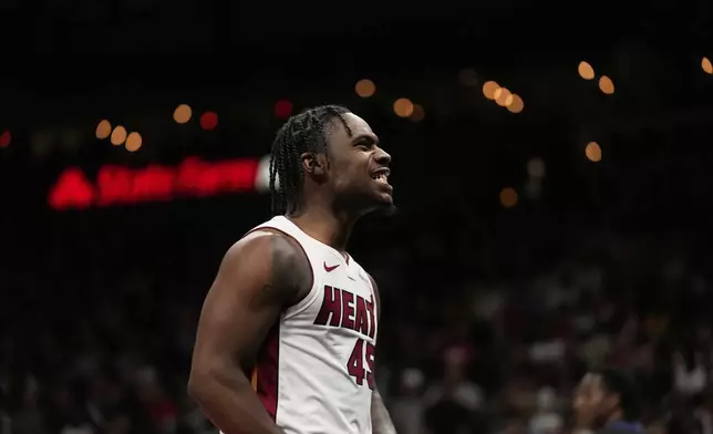 Miami Heat guard Davion Mitchell (45) reacts in the second half of an NBA play-in tournament basketball game against the Atlanta Hawks, Friday, April 18, 2025, in Atlanta. (AP Photo/Brynn Anderson)