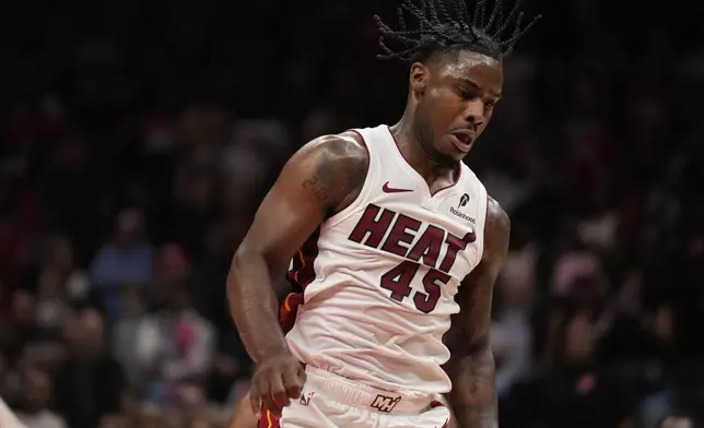 Miami Heat guard Davion Mitchell (45) is seen in overtime of an NBA play-in tournament basketball game against the Atlanta Hawks, Friday, April 18, 2025, in Atlanta. (AP Photo/Brynn Anderson)