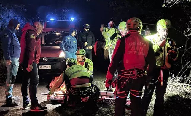 Rescuers on the site where a cable car carrying tourists south of Naples has crashed after the cable snapped, killing at least four people and injuring one in Castellamare di Stabia, near Naples, Italy, Thursday, April 17, 2025. (Alessandro Garofalo/LaPresse via AP)