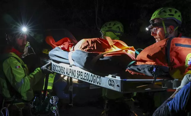Rescuers recoup the body of one of the victims of a cable car carrying tourists south of Naples which crashed after the cable snapped, killing at least four people and injuring one in Castellamare di Stabia, near Naples, Italy, Thursday, April 17, 2025. (AP Photo/Salvatore Laporta)