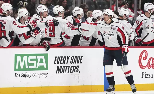 Washington Capitals' Dylan Strome (17) returns to the bench after scoring during the second period of an NHL hockey game against the Pittsburgh Penguins in Pittsburgh, Thursday, April 17, 2025. (AP Photo/Gene J. Puskar)