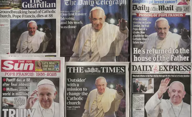 Newspapers with the front page of the late Pope Francis are seen in London, Tuesday, April 22, 2025. (AP Photo/Kin Cheung)