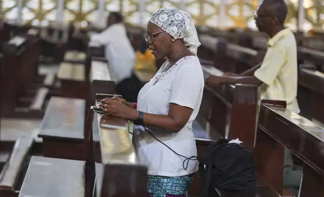 People attend a morning Mass at the Christ the King Catholic Parish in Accra, Ghana, Tuesday, Apr 22, 2025 (AP Photo/Misper Apawu)