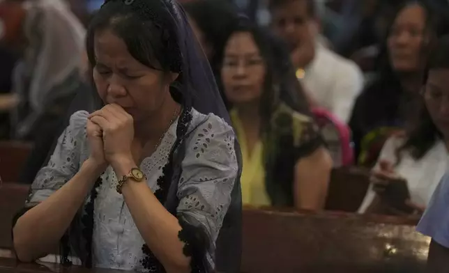 Myanmar Christians attend a prayer for Pope Francis at St. Mary Cathedral Tuesday, April 22, 2025, in Yangon, Myanmar. (AP Photo/Thein Zaw)