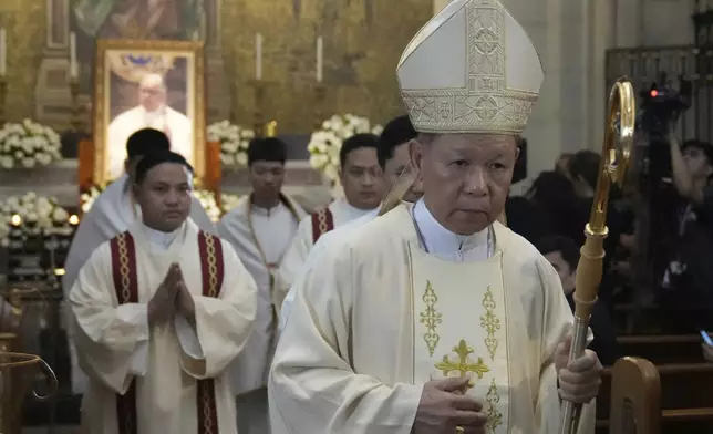 Philippine Cardinal Jose Advincula, right, leads others during a mass for the late Pope Francis at the Manila Cathedral in the country's capital, Philippines Tuesday April 22, 2025. (AP Photo/Aaron Favila)