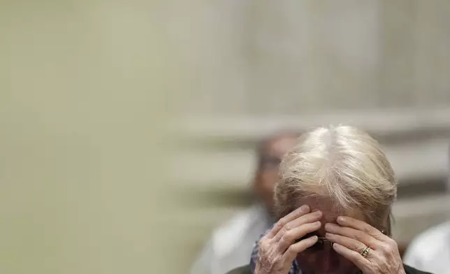 A parishioner cries during a mass for the late Pope Francis at St. Patrick's Cathedral, Tuesday, April 22, 2025, in New York. (AP Photo/Julia Demaree Nikhinson)
