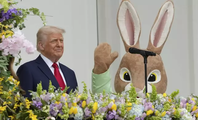 President Donald Trump arrives on the Blue Room Balcony to participate in the White House Easter Egg Roll Monday, April 21, 2025, in Washington. (AP Photo/Alex Brandon)