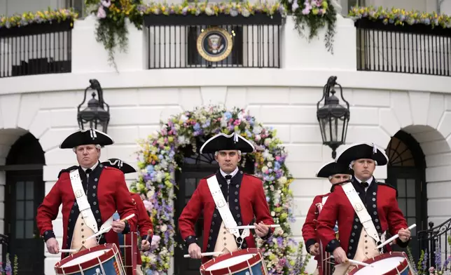 Members of the United States Army Old Guard Fife and Drum Corps give a musical demonstration during the White House Easter Egg Roll on the South Lawn of the White House, Monday, March 24, 2025, in Washington. (AP Photo/Mark Schiefelbein)