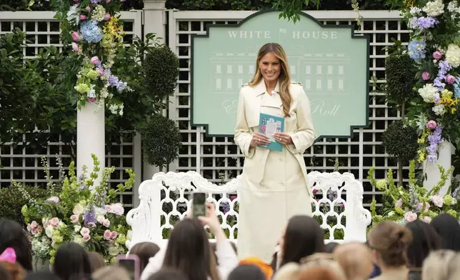 First lady Melania Trump arrives to read a book to children during the White House Easter Egg Roll at the White House, Monday, April 21, 2025, in Washington. (AP Photo/Mark Schiefelbein)