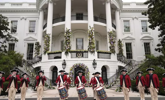 Members of the United States Army Old Guard Fife and Drum Corps give a musical demonstration during the White House Easter Egg Roll on the South Lawn of the White House, Monday, March 24, 2025, in Washington. (AP Photo/Mark Schiefelbein)