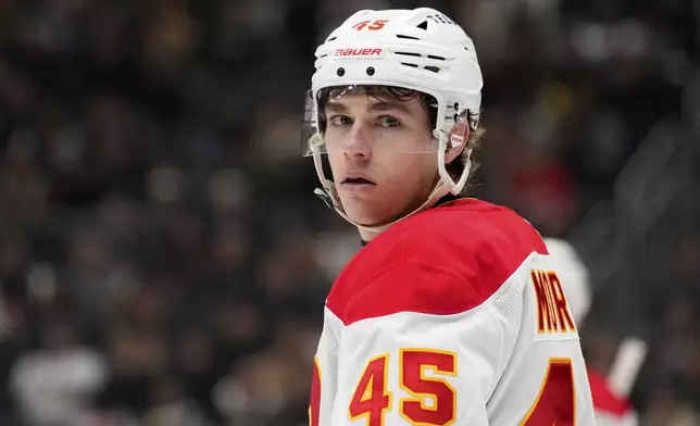 Calgary Flames center Sam Morton stands on the ice during the second period of an NHL hockey game against the Los Angeles Kings, Thursday, April 17, 2025, in Los Angeles. (AP Photo/Mark J. Terrill)