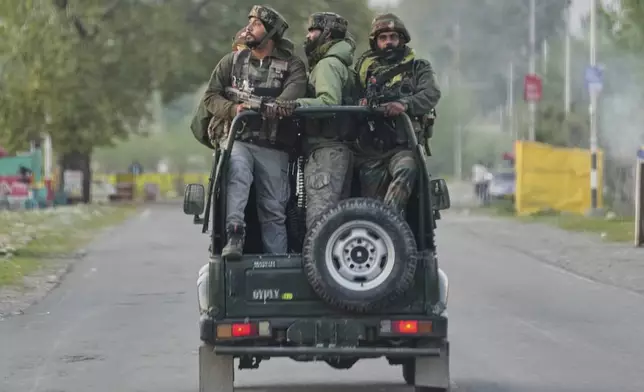 Indian Army soldiers patrol in armored vehicle near Pahalgam in south Kashmir after assailants indiscriminately opened fire on tourists visiting Pahalgam, Indian controlled Kashmir, Tuesday, April 22, 2025. (AP Photo/Dar Yasin)