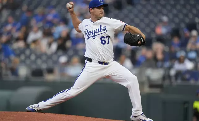 Kansas City Royals starting pitcher Seth Lugo throws during the first inning of a baseball game against the against the Minnesota Twins, Wednesday, April 9, 2025, in Kansas City, Mo. (AP Photo/Charlie Riedel)
