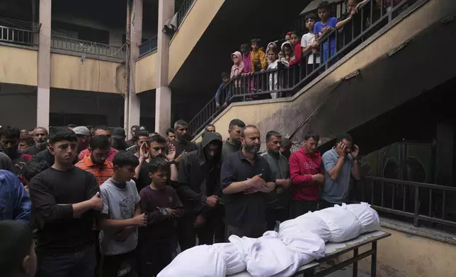 Palestinians bid farewell to their relatives who were killed in Israeli airstrikes early this morning on Yaffa School, in Gaza City, Wednesday, April 23, 2025. (AP Photo/Jehad Alshrafi)