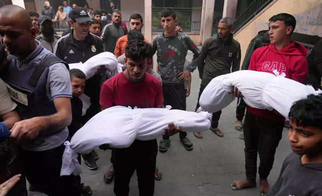 Palestinians bid farewell to their relatives who were killed in Israeli airstrikes early this morning on Yaffa School, in Gaza City, Wednesday, April 23, 2025. (AP Photo/Jehad Alshrafi)