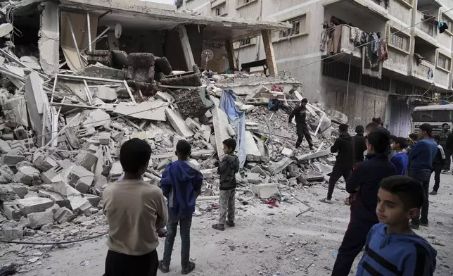 Palestinians inspect the damage after an Israeli army airstrike in Gaza City, on Saturday, April 26, 2025. (AP Photo/Jehad Alshrafi)