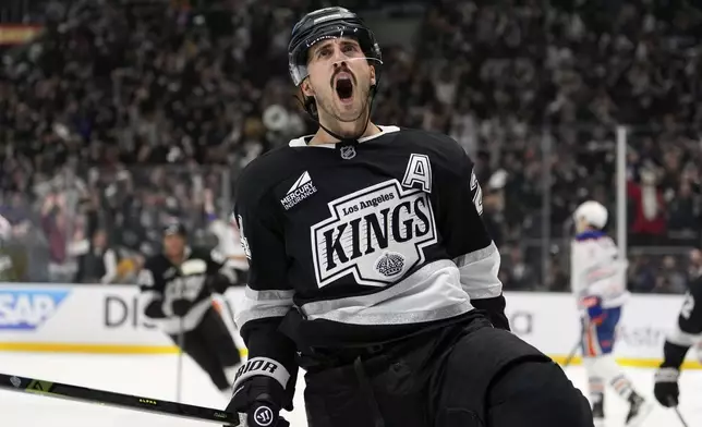 Los Angeles Kings center Phillip Danault celebrates his goal during the second period in Game 1 of an NHL hockey first-round playoff series against the Edmonton Oilers, Monday, April 21, 2025, in Los Angeles. (AP Photo/Mark J. Terrill)
