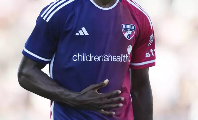 FC Dallas defender Osaze Urhoghide (3) celebrates his goal against the Inter Miami during the second half of an MLS soccer match, Sunday, April 27, 2025, in Fort Lauderdale, Fla. (AP Photo/Jim Rassol)