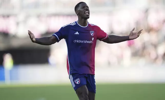 FC Dallas defender Osaze Urhoghide (3) celebrates his goal against Inter Miami during the second half of an MLS soccer match, Sunday, April 27, 2025, in Fort Lauderdale, Fla. (AP Photo/Jim Rassol)