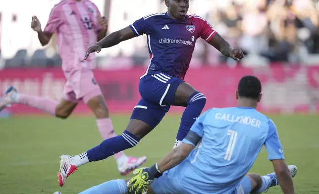 FC Dallas midfielder Anderson Julio (11) jumps over Inter Miami goalkeeper Drake Callender (1) as he follows his goal during the second half of an MLS soccer match, Sunday, April 27, 2025, in Fort Lauderdale, Fla. (AP Photo/Jim Rassol)