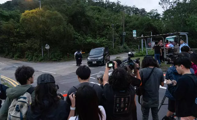 Members of media wait outside the Shek Pik Prison as former pro-democracy lawmaker, Gary Fan, was released after four years for his conviction under the national security law in Hong Kong, Tuesday, April 29, 2025. (AP Photo/Chan Long Hei)