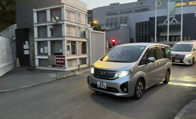 Vehicle carrying former legislator Claudia Mo out of Lo Wu Correctional Institution, a women's prison early Tuesday, April 29, 2025. The former legislator was imprisoned for taking part in a primary election for pro-democracy politicians in 2020. (AP Photo/Jonathan Lee)