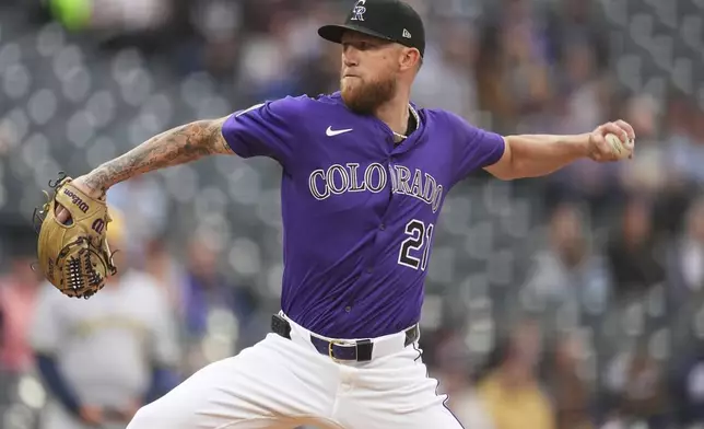 Colorado Rockies starting pitcher Kyle Freeland works against the Milwaukee Brewers in the first inning of a baseball game Tuesday, April 8, 2025, in Denver. (AP Photo/David Zalubowski)