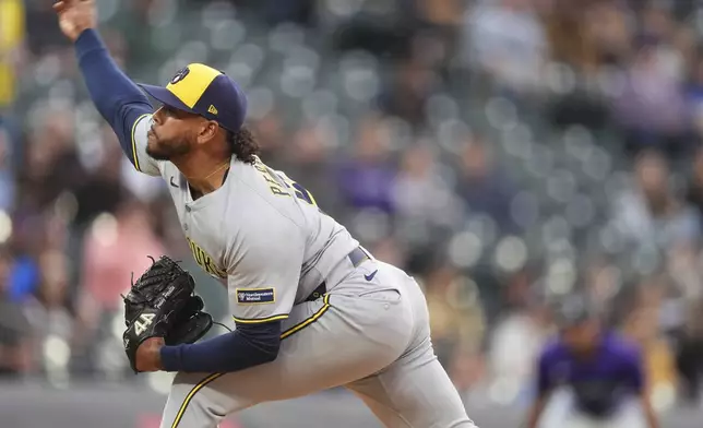 Milwaukee Brewers starting pitcher Freddy Peralta works against the Colorado Rockies in the first inning of a baseball game Tuesday, April 8, 2025, in Denver. (AP Photo/David Zalubowski)