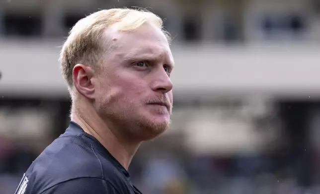 Chicago White Sox's Andrew Vaughn watches the outfield from the dugout during the sixth inning of a baseball game against the Athletics, Saturday, April 26, 2025, in West Sacramento, Calif. (AP Photo/Sara Nevis)
