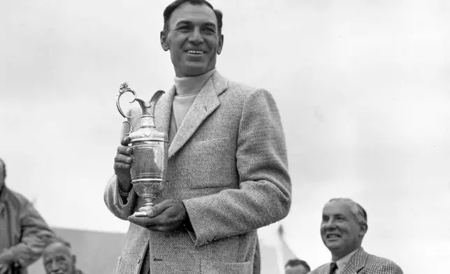 FILE - In this July 10, 1953, file photo, Ben Hogan holds his trophy after winning the British Open Golf Championship at Carnoustie, Scotland. (AP Photo/Dennis Lee Royle, File)