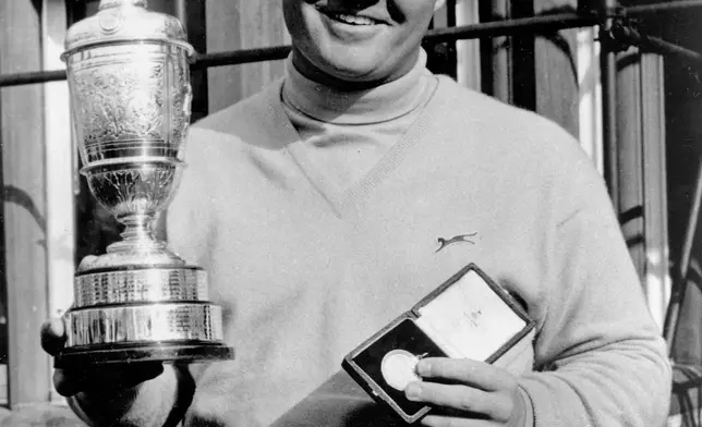 FILE - In this July 9, 1966, file photo, Jack Nicklaus, of the United States, holds the Claret Jug trophy and gold medal after winning the British Open Golf Championship at Muirfield, Scotland. (AP Photo/File)