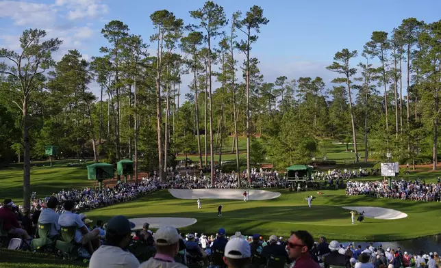 Scottie Scheffler putts on the 16th hole during the second round at the Masters golf tournament, Friday, April 11, 2025, in Augusta, Ga. (AP Photo/Julia Demaree Nikhinson)