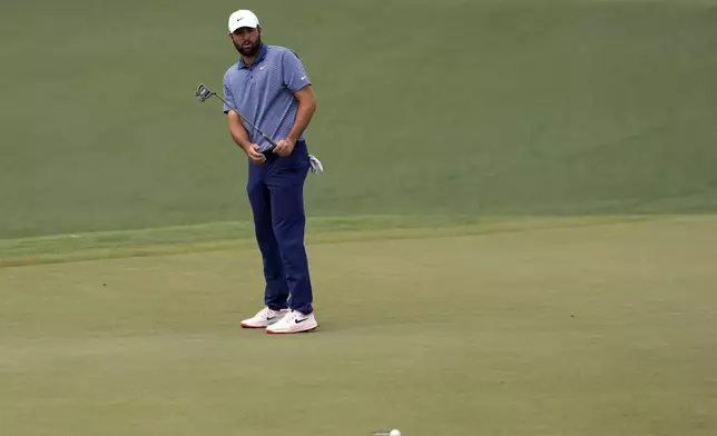Scottie Scheffler reacts after missing a putt on the second hole during the second round at the Masters golf tournament, Friday, April 11, 2025, in Augusta, Ga. (AP Photo/Ashley Landis)