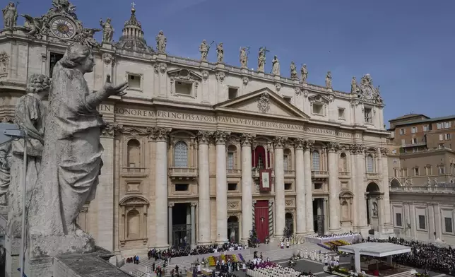 Cardinal Angelo Comastri arrives with the procession to preside over the Easter mass in St. Peter's Square at the Vatican Sunday, April 20, 2025. (AP Photo/Gregorio Borgia)
