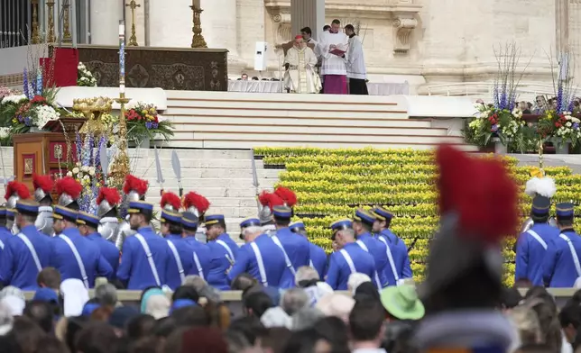 Cardinal Angelo Comastri presides over the Easter mass in St. Peter's Square at the Vatican Sunday, April 20, 2025. (AP Photo/Andrew Medichini)