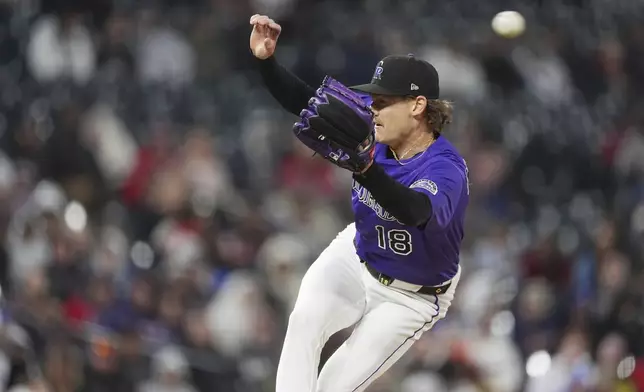 Colorado Rockies starting pitcher Ryan Feltner misses a double hit by Atlanta Braves' Michael Harris II to drive in two runs in the fifth inning of a baseball game Monday, April 28, 2025, in Denver. (AP Photo/David Zalubowski)