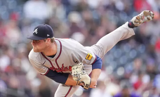 Atlanta Braves starting pitcher Bryce Elder works against the Colorado Rockies in the first inning of a baseball game Monday, April 28, 2025, in Denver. (AP Photo/David Zalubowski)
