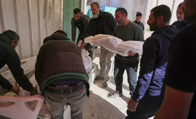 Palestinians prepare for burial the bodies of several members of the al-Atal family, killed in an Israeli airstrike on a tent in the Jabalia refugee camp, at the Indonesian hospital in Beit Lahia, northern Gaza Strip, Thursday, April 17, 2025.(AP Photo/(AP Photo/Jehad Alshrafi)