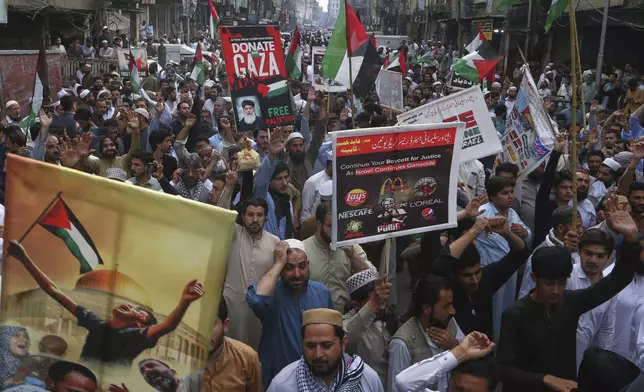 Traders hold a demonstration against Israeli airstrikes and to show solidarity with Palestinian people living in Gaza, in Peshawar, Pakistan Friday, April 18, 2025. (AP Photo/Muhammad Sajjad)