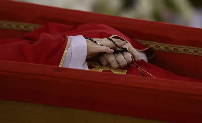 Pope Francis's body is laid out in state inside his private chapel at the Vatican, Monday, April 21, 2025. (Vatican Media via AP, HO)