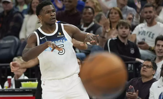 Minnesota Timberwolves guard Anthony Edwards (5) gestures after making a 3-point basket during the first half of an NBA basketball game against the Brooklyn Nets, Friday, April 11, 2025, in Minneapolis. (AP Photo/Abbie Parr)